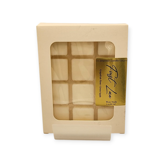 First Love wax melt by Journey Candle Co. – sweet blend of grapefruit, rose, and green apple in cream packaging. Fruity floral fragrance, 3 oz. Bright and romantic fragrance perfect for self-care, gifts, or everyday home use.