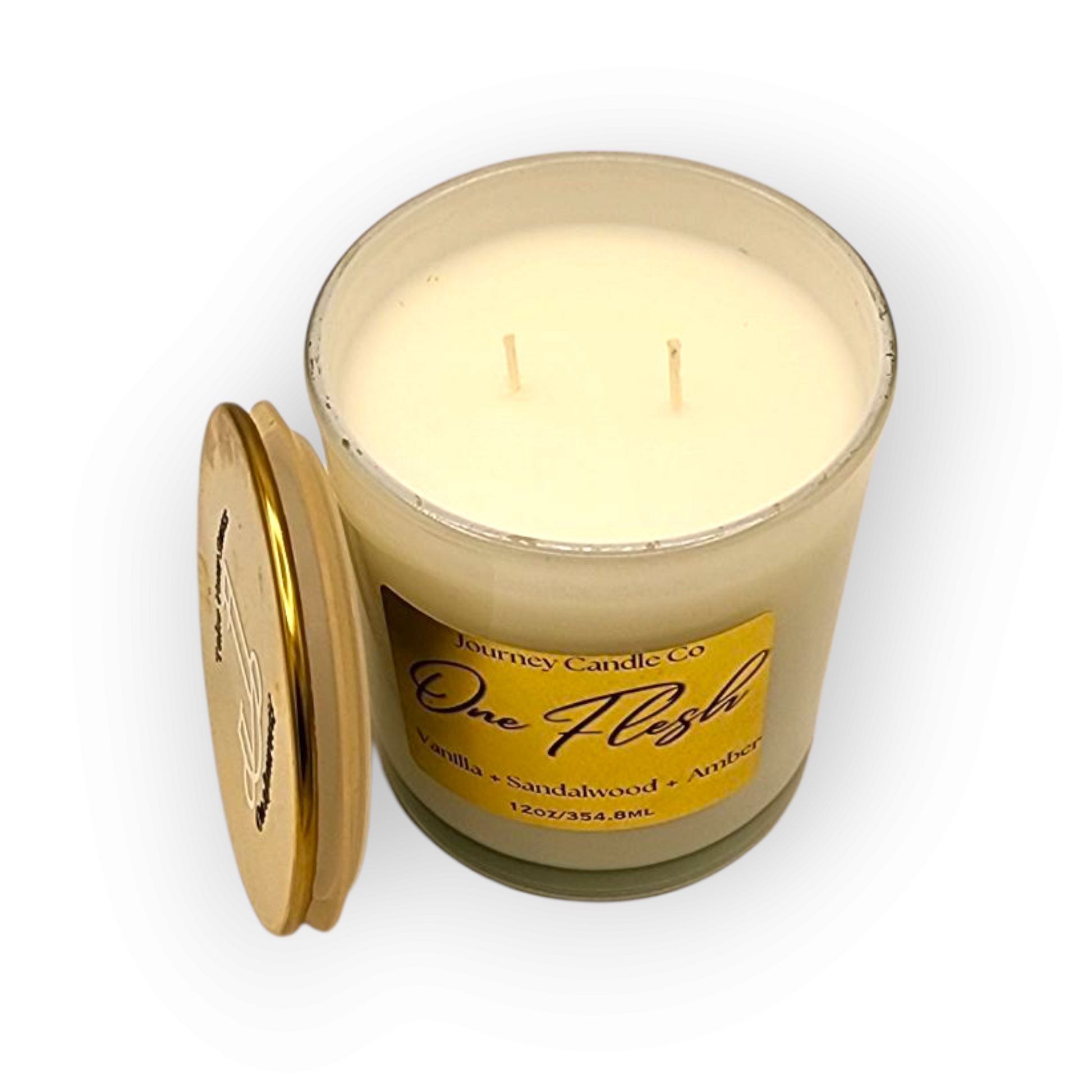 One Flesh 12 oz soy candle by Journey Candle Co. – warm blend of vanilla, sandalwood, and amber in white jar with gold lid. Romantic, long-lasting home fragrance perfect for cozy spaces or gifting.