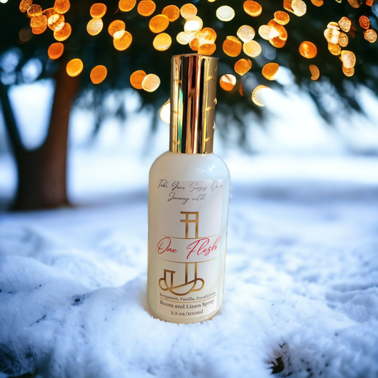 One Flesh room and linen spray by Journey Candle Co. – warm blend of creamy vanilla, golden amber, and soft sandalwood in a 3 oz gold-capped spray bottle.