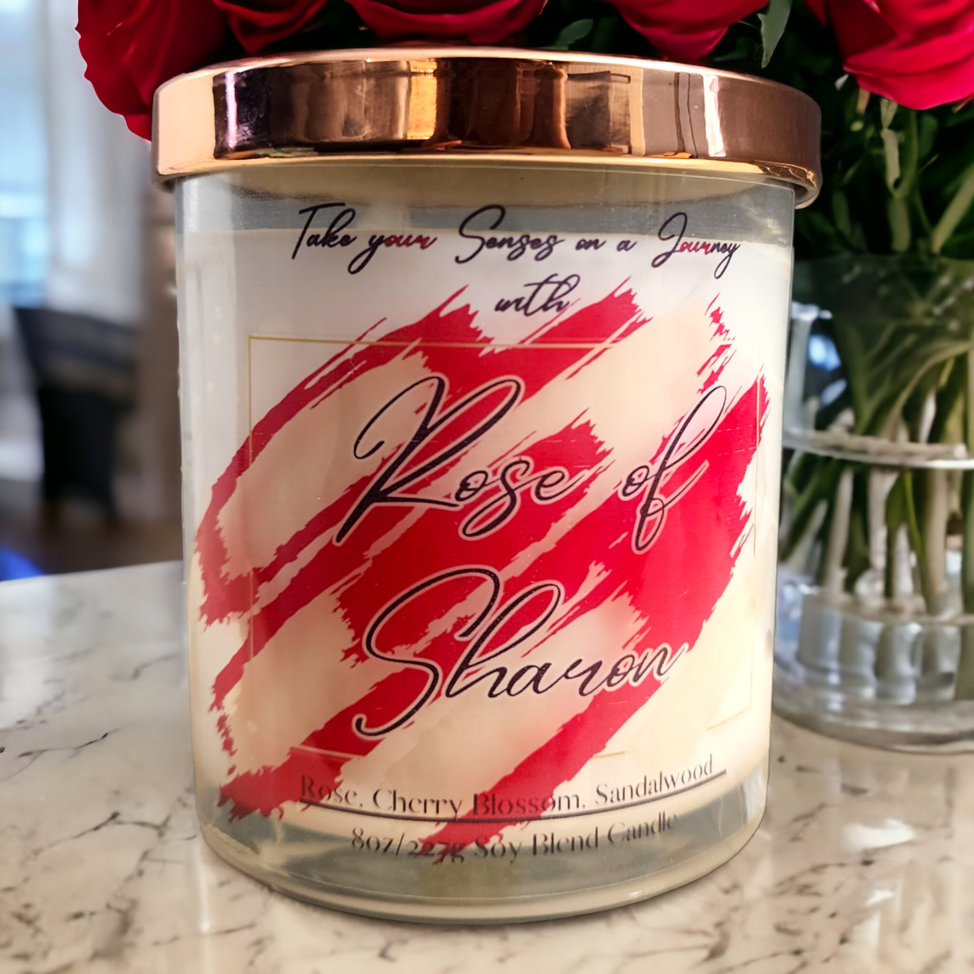 Rose of Sharon 8 oz scented candle with soft rose, delicate cherry blossom, and warm sandalwood – hand-poured in a clear glass jar with a gold lid