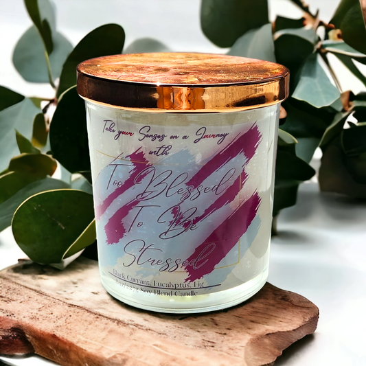 Elegant 8 oz candle in a glass jar with gold lid and custom gift box. Infused with black currant, eucalyptus, and fig for a calming, luxe aroma.