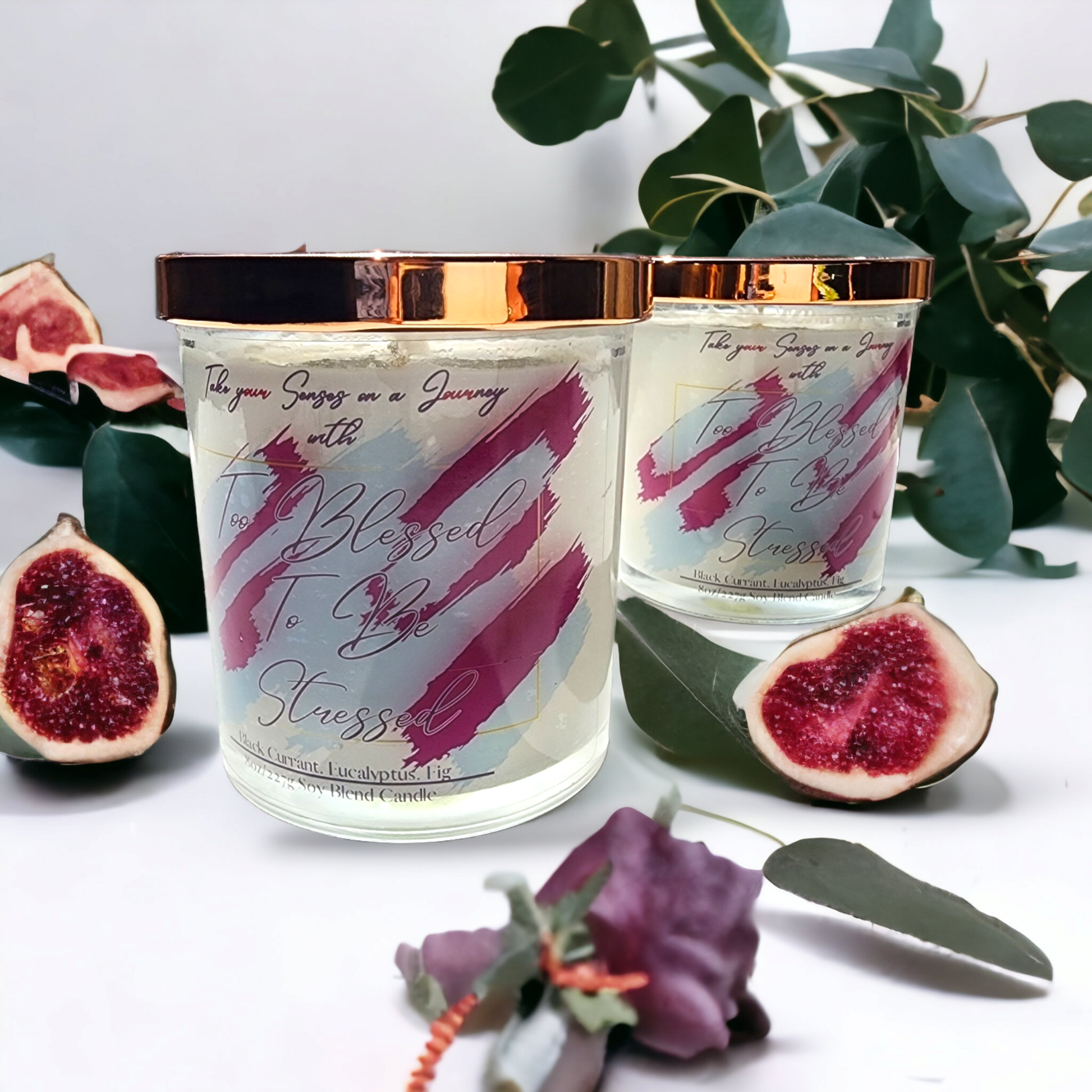 Elegant 8 oz candle in a  glass jar with gold lid and custom gift box. Infused with black currant, eucalyptus, and fig for a calming, luxe aroma.