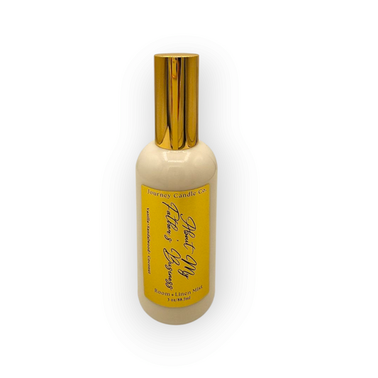 About My Father’s Business room and linen spray by Journey Candle Co. – warm vanilla, creamy coconut, and soft sandalwood in 3 oz gold-capped spray bottle.

